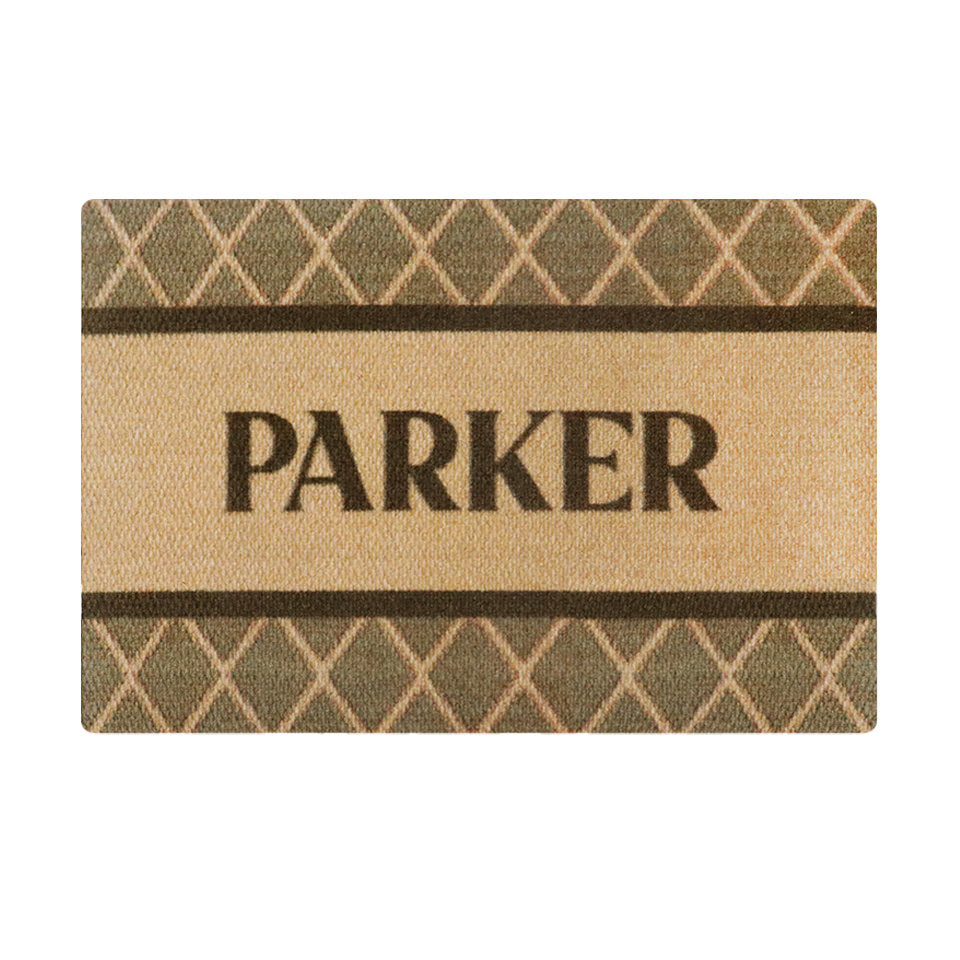 Single door size Argyle mat personalized with last name across the center of the mat in brown font on coir background