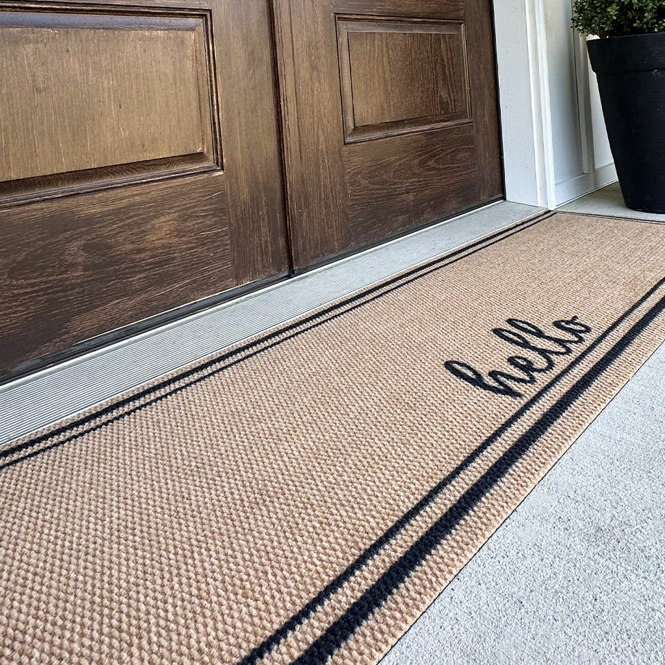 Close up images of Neighburly's Around The Block non-shedding, low-profile surface, personalized with hello.
