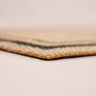 Close-up corner shot of Around the Block low profile and non shedding surface backed by rubber.