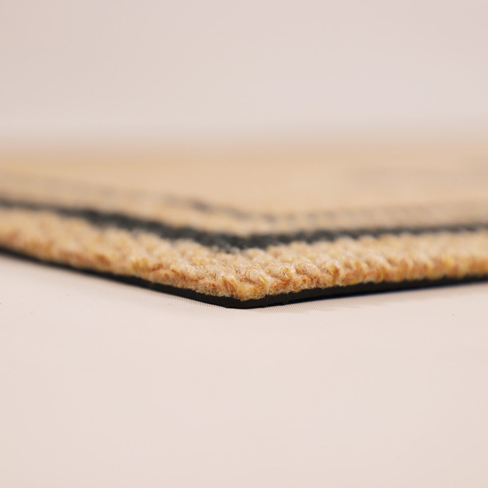 Close-up corner shot of Around the Block low profile and non shedding surface backed by rubber.