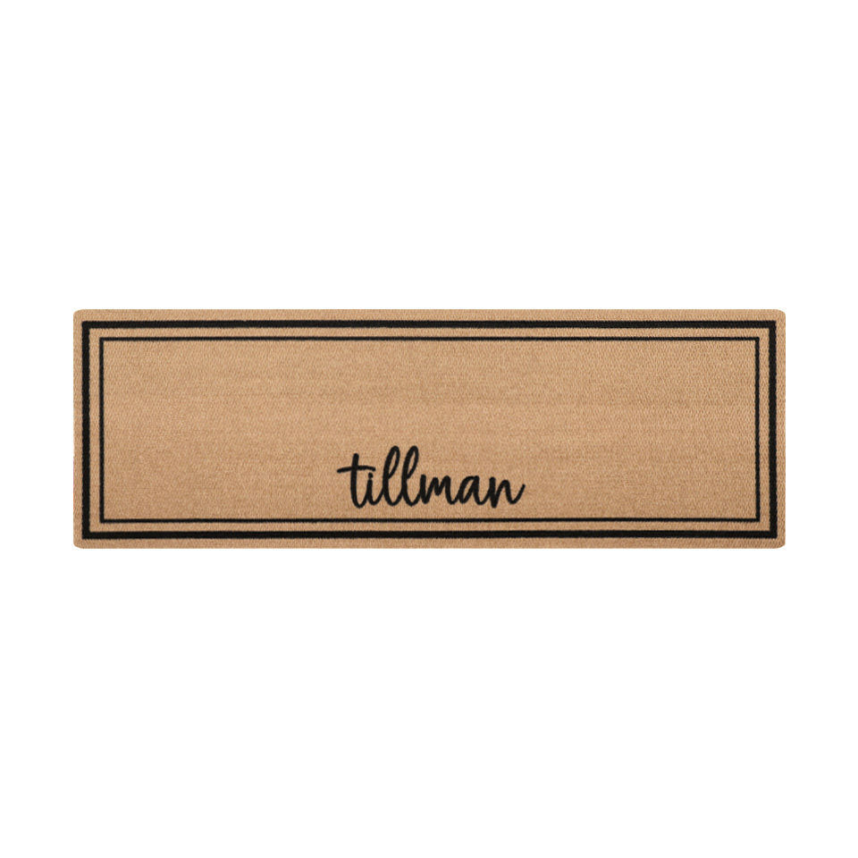 Overhead of double door Around the Block mat personalized with name in script with two black lines around the perimeter.