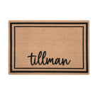 Overhead of single door Around the Block mat personalized with name in script with two black lines around the perimeter.