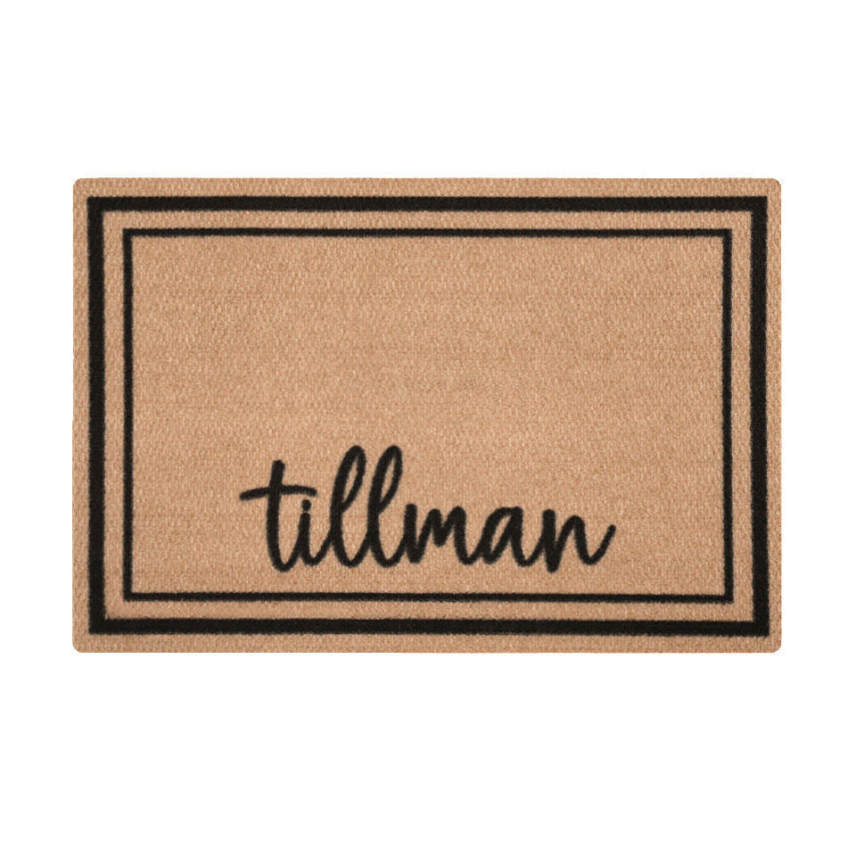 Overhead of single door Around the Block mat personalized with name in script with two black lines around the perimeter.