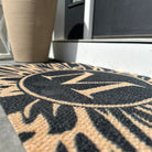 Close up image of Dahlia monogrammed non shedding surface and low-profile printed in high definition.