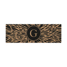 Overhead double door Dahlia mat centered monogrammed G abstract line around it, black and coir