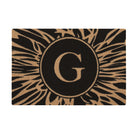 Overhead single door Dahlia mat centered monogrammed G abstract line around it, black and coir