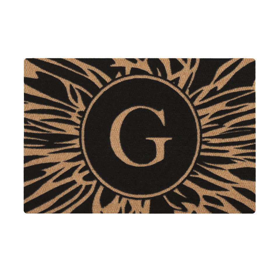 Overhead single door Dahlia mat centered monogrammed G abstract line around it, black and coir