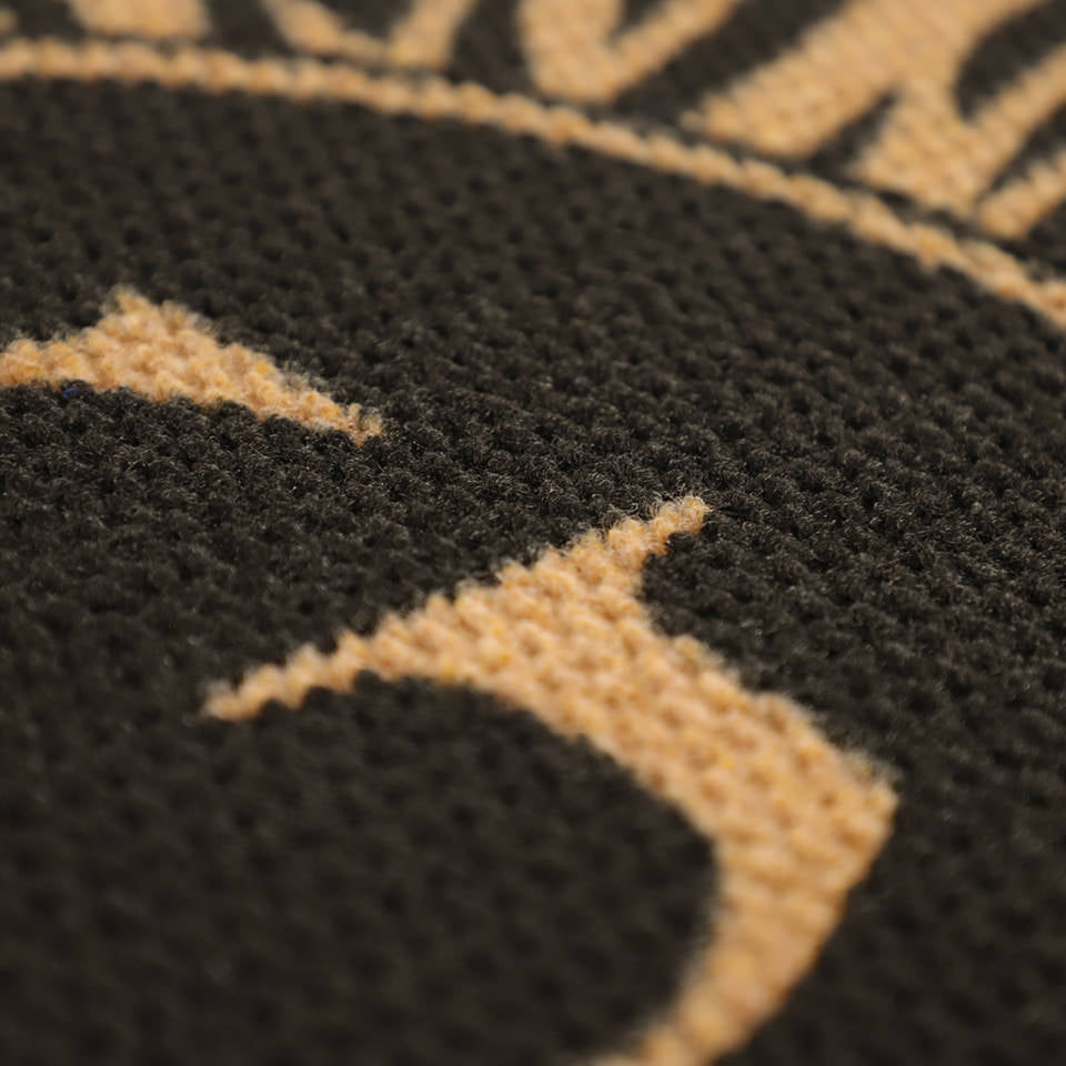 Detail shot of Dahlia mat’s black and coir, no shed surface