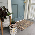 Single door Diamond Dot Neighubrly mat colored in black and coir with a non shedding surface and rubber backing.
