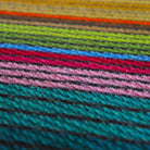 Bright colored doormat is water resistant and will not rot or shed like coir mats.