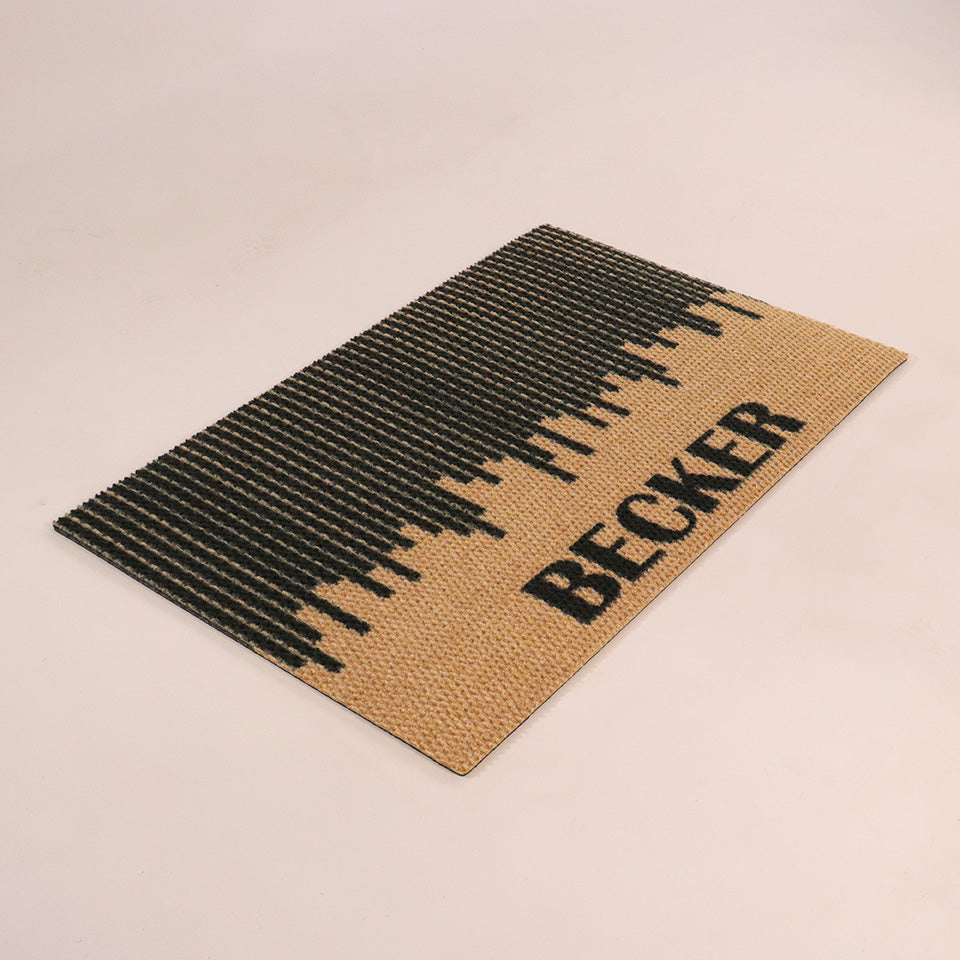 Angled shot of Fall in Line personalized single-sized doormat featuring a last name in black on a black and coir design.