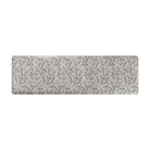 Comfortable foam anti-fatigue runner mat with beautiful black/brown botanical design on a beige background.