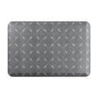 Happy Feet’s Crossing Paths anti-fatigue small mat with a repetitive, interlocking design on a grey background.
