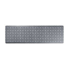 Happy Feet’s Crossing Paths anti-fatigue runner mat with a repetitive, interlocking design on a grey background.