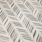Detailed surface shot of featherbone's whimsical, feather design on a wipeable surface