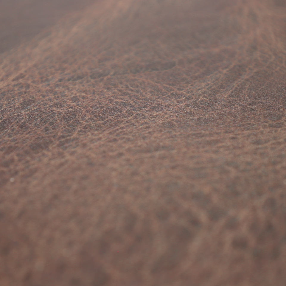 Detail image of Happy Feet's leather surface in espresso brown with a water-resistant, wipeable surface