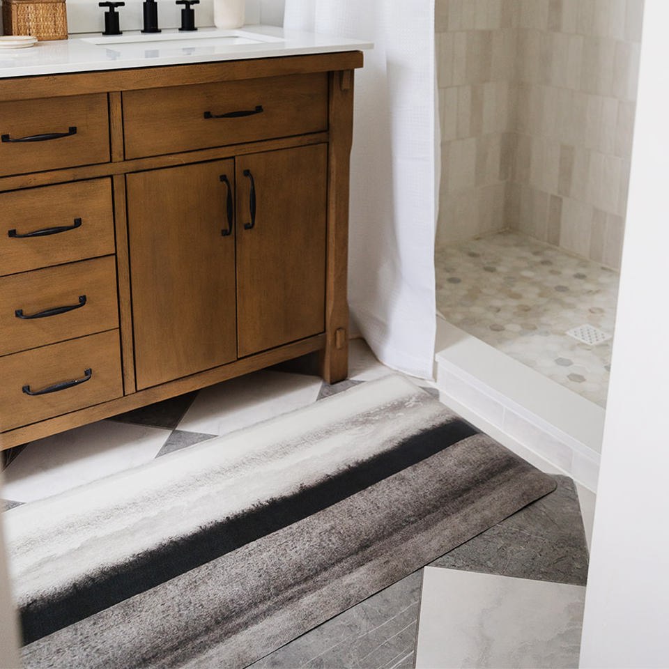 Wipeable and waterproof Moody Hues anti-fatigue Happy Feet runner bathroom mat proving standing comfort.