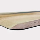 Corner of Happy Feet anti-fatigue foam cushion mat with watercolor landscape printed on a canvas-like texture.