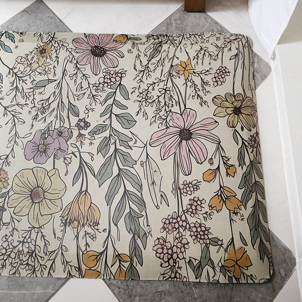 Whimsical floral design on Wildflower's Happy Feet comfort mat with a wipeable and waterproof surface.