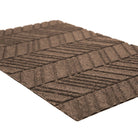 Close up of greige chevron patterned bi level doormat