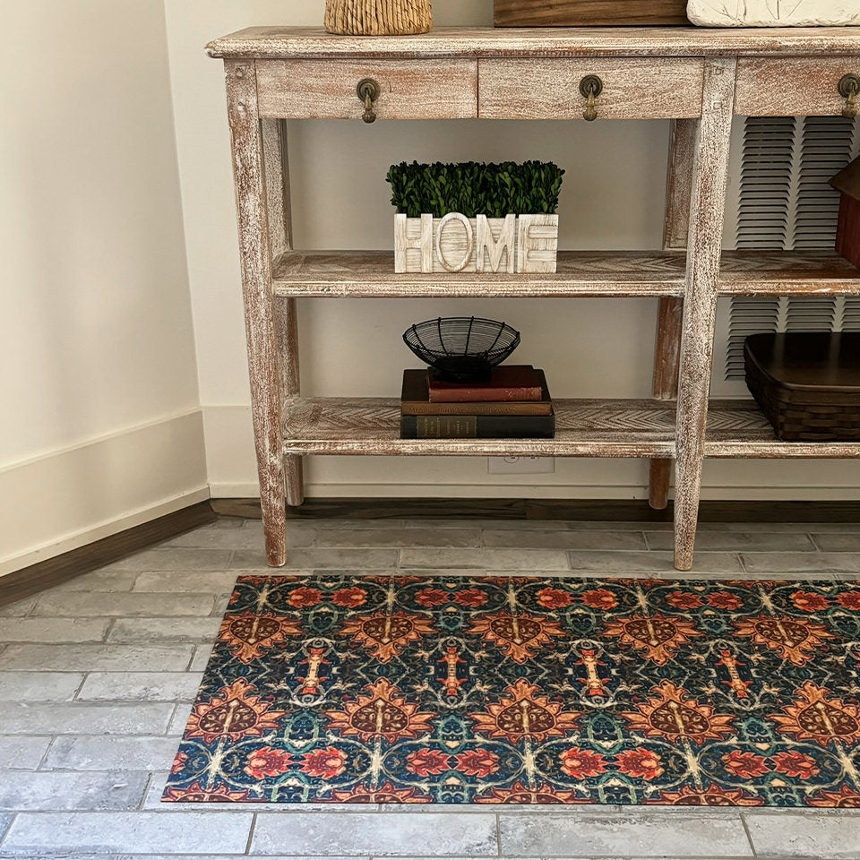 Low-profile Persian Un-Rug runner decorative mat in front of a hallway worn wooden table