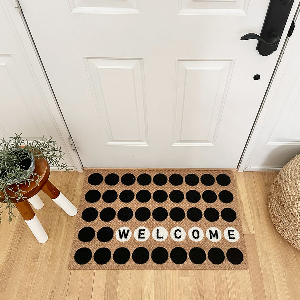 Neighburly's Lucky Numbers personalized with welcome in the white circles on a non shedding, eco-friendly surface for the front door.