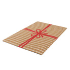 Unique and cute Christmas themed welcome that looks like a brown and white striped present with red bow.