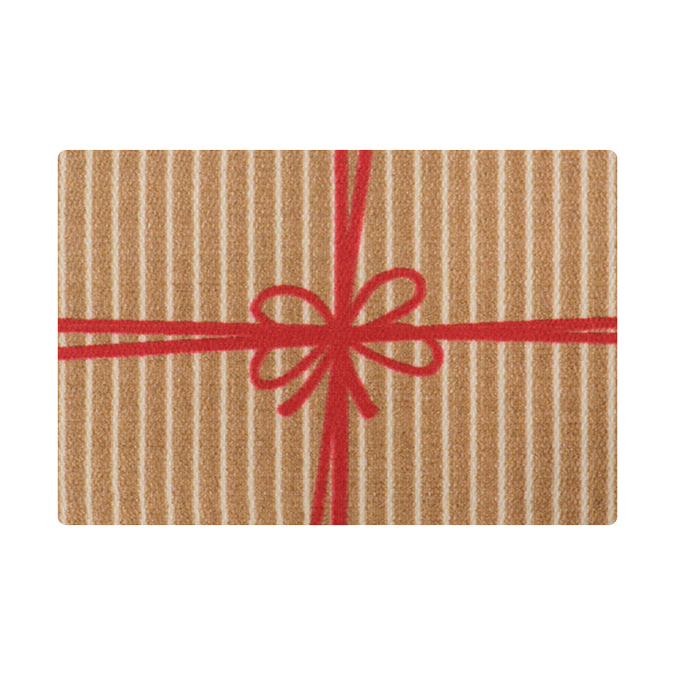 Cute holiday themed door mat that looks like a brown and white striped present with red bow.