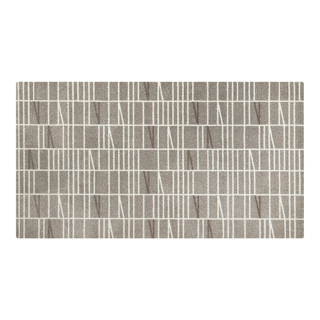 Maxcent Biblioteca area mat in Light Greige, medium size – features a structured grid and white angle pattern on a grey, soft, low-profile carpeted surface. Designed with a non-slip rubber backing to stay firmly in place on hard floors, ideal for kitchens, entryways, or laundry rooms.