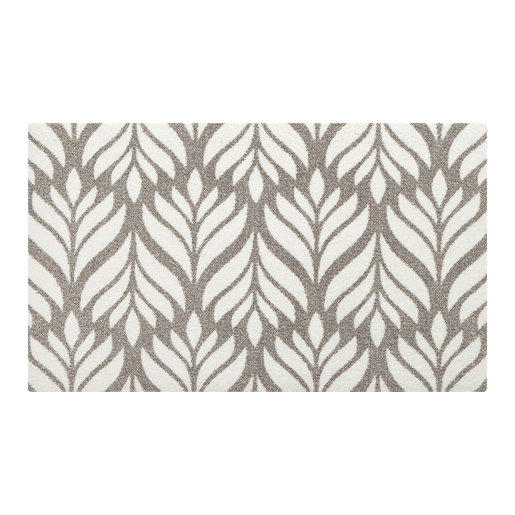 Top-down image of Maxcent Botanica accent mat in light greige with soft brown botanical pattern—stylized leaf design in a washable, low-profile format.