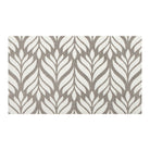 Top-down image of Maxcent Botanica accent mat in light greige with soft brown botanical pattern—stylized leaf design in a washable, low-profile format.