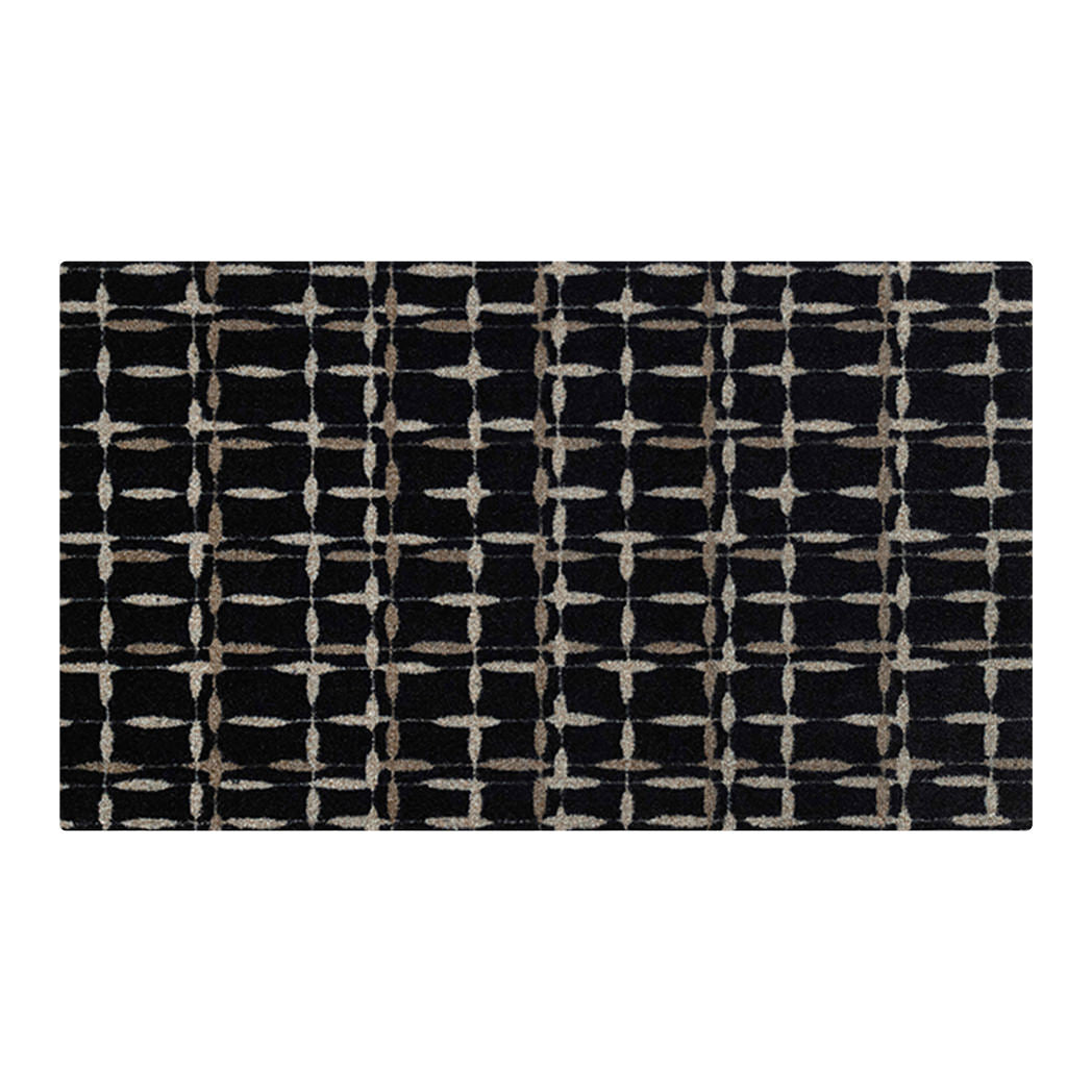 Isolated image of Maxcent Heritage Tweed accent mat in inkwell with layered plaid pattern—bold black base with light gridlines for dramatic floor contrast.