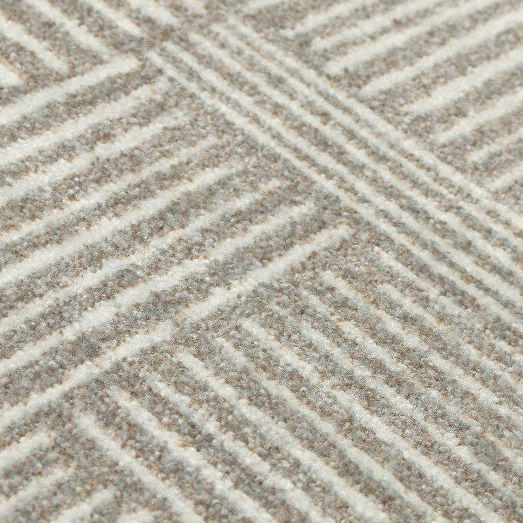 Close-up view of the Maxcent Organic Squares floor mat, highlighting the soft texture and detailed weave of alternating horizontal and vertical stripes in a blend of stone gray and sandy beige tones.