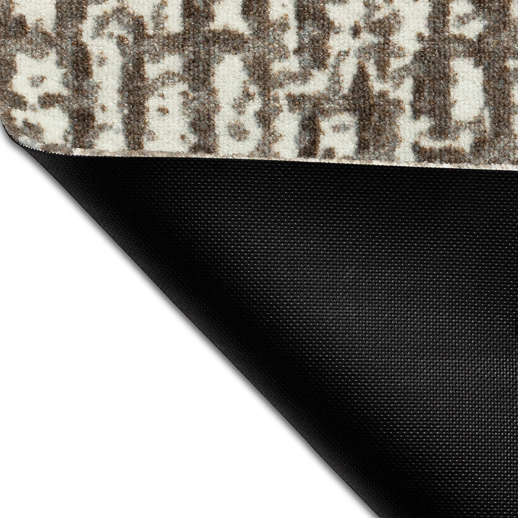 Underside of Maxcent Stone Weave all-in-one rug, mat, and carpet showcasing its non-slip rubber backing and durable construction — designed to stay in place on hard floors while offering modern style and comfort on top.