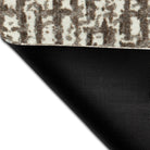 Underside of Maxcent Stone Weave all-in-one rug, mat, and carpet showcasing its non-slip rubber backing and durable construction — designed to stay in place on hard floors while offering modern style and comfort on top.