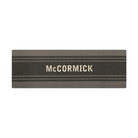 Overhead of double door Modern Moniker mat, personalized name on dark grey bar with two  lines on a grey background.