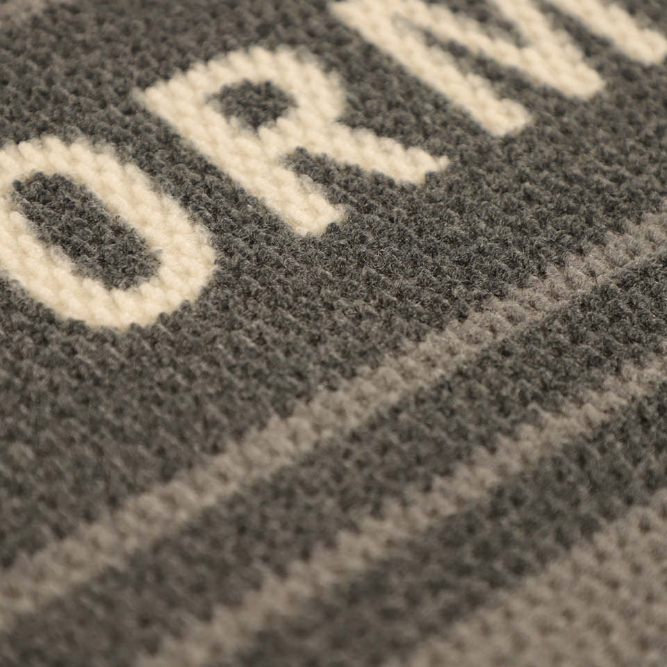 Detailed shot of Modern Moniker’s non shedding surface in light and dark grey.