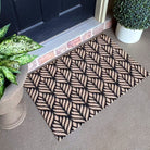 Single door Botinical Neighburly doormat in black and coir featuring a non-shedding surface and low-profile.