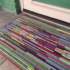closeup of dutch fields horizontal mat outside front entryway
