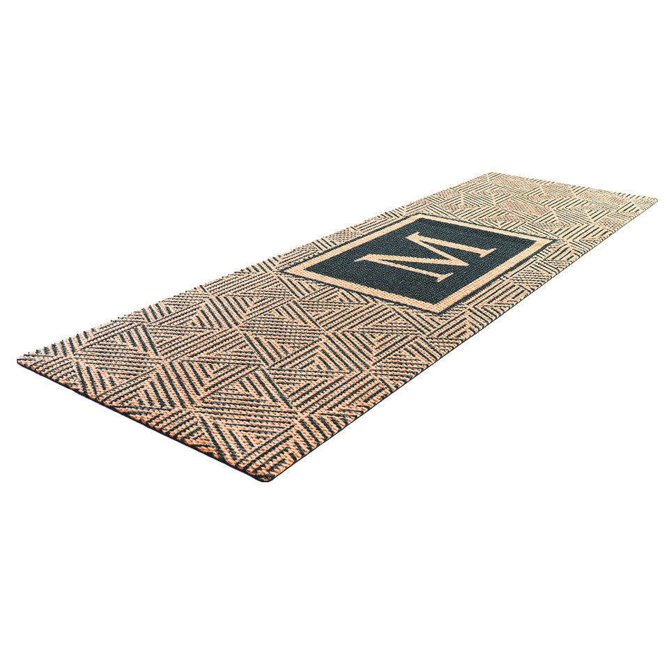 Long monogrammed doormat for double doors, the brown and black Escher doormat fits in front of sliding doors and double doors.