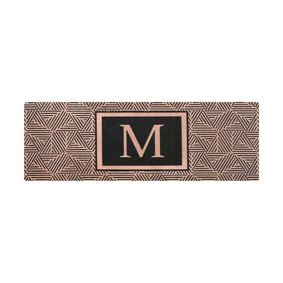 Unique doormats for double doors; the Escher doormat is a unique door mat with a modern geometric design in brown and black with an eye catching letter in the middle.