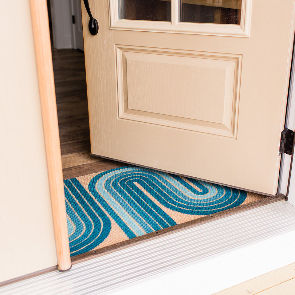 Low-profile Neighburly Mat under an easily open door without catching on the mat.