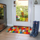 Neighburly's Colorful Tulips single door mat located at the side door of the home.