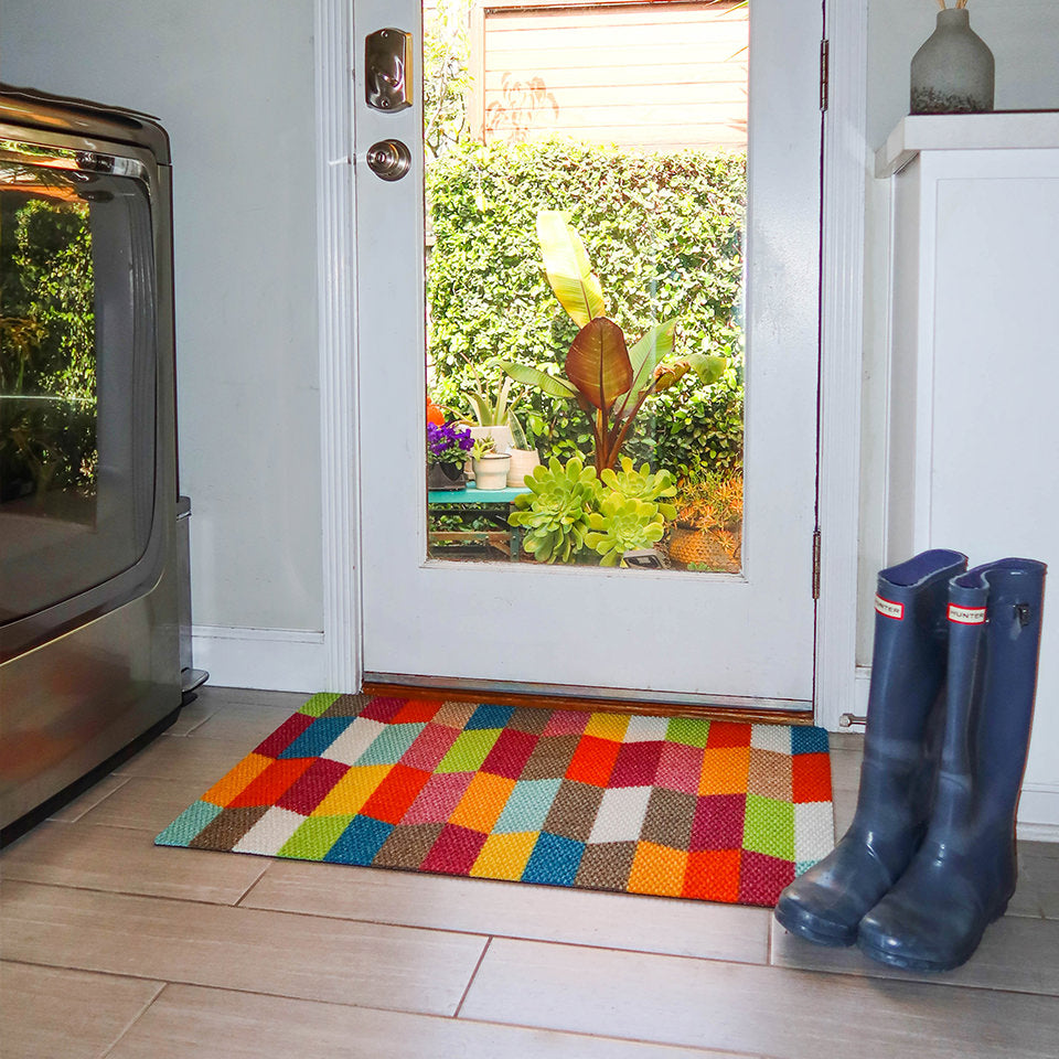 Neighburly's Colorful Tulips single door mat located at the side door of the home.