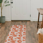 Un-Rug floral design Poppies runner mat in earthen jug red and cream places at the entrance of the doorway for floor protection and minimal moved due to its all rubber backing.