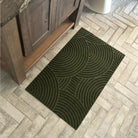 Birds eyes view of an olive green Put Your Records On mat in the bathroom on tile floors