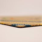 Close-up corner shot of Rainbow Roundabout’s low profile and non shedding surface backed by rubber.