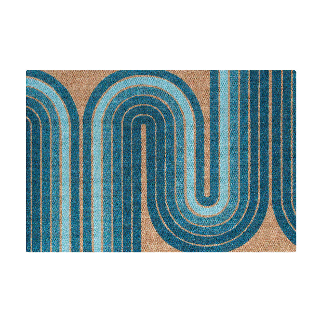 The groovy Retro Vibes Neighburly doormat with blue gradient stripe making racetrack-like pattern on a coir background