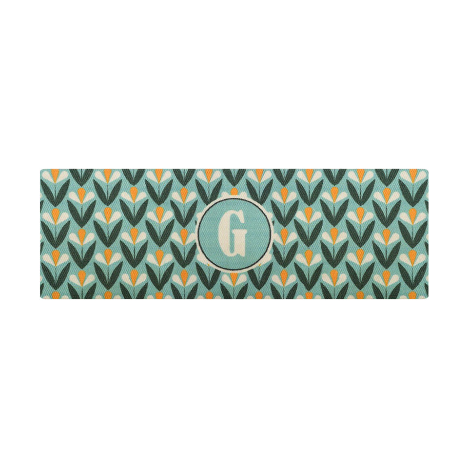 Spring Blooms Monogrammed doormat features a cute retro floral design and is shown in the larger double door doormat size.