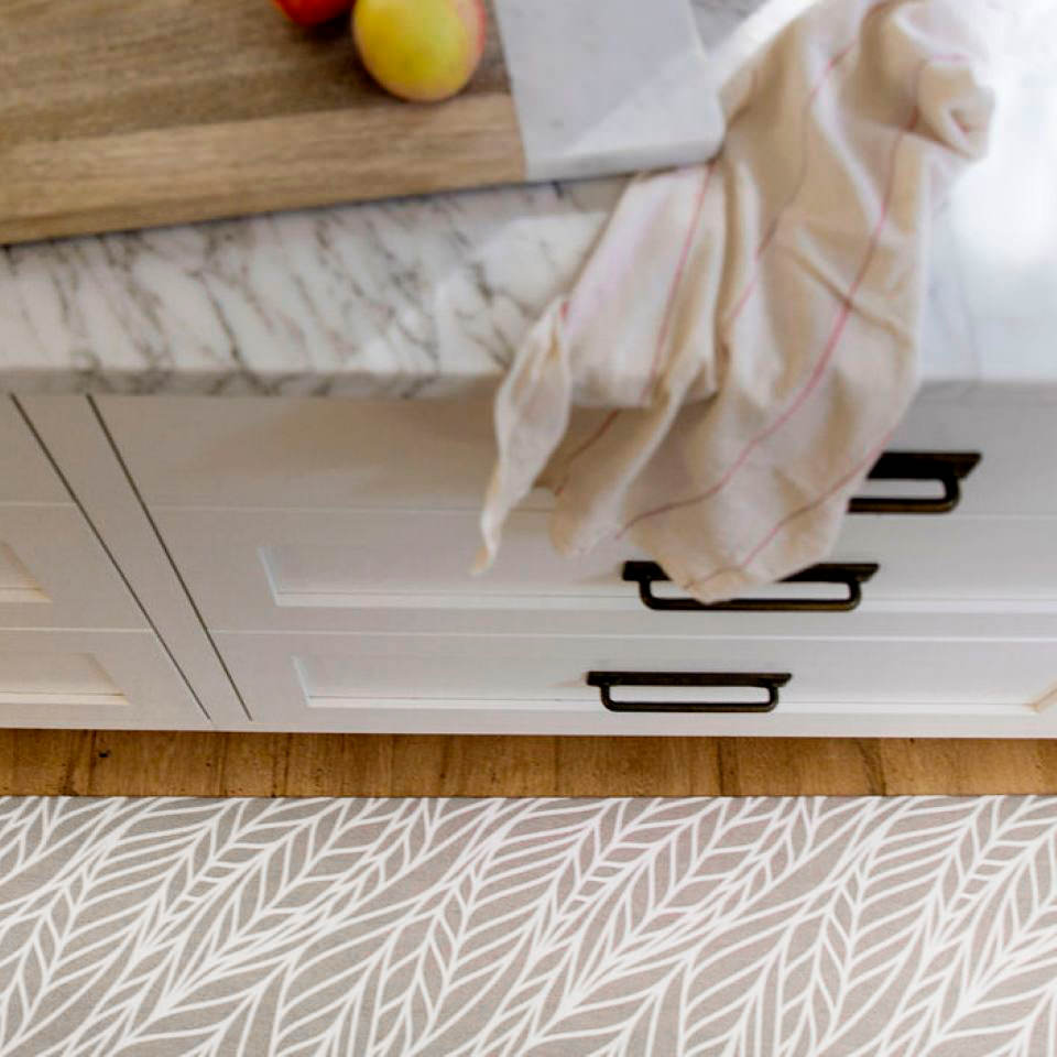 Abstract cream colored leaf pattern on shiitake tan linen look low profile washable floormat